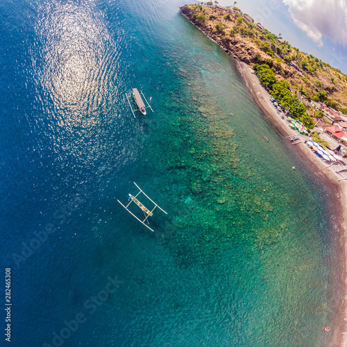 Jemeluk Bay, Amed. Amed is fast becoming a popular tourist destination in Bali, Indonesia. Set in the North-East of Bali, it is a home to excellent snorkeling, scuba diving, freediving and yoga photo