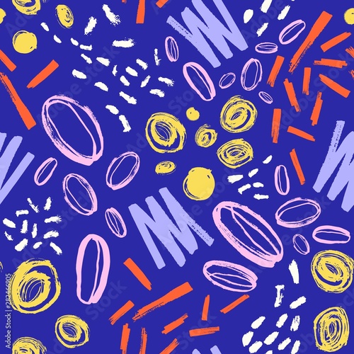 Hand painted seamless pattern with vivid marks, stains on blue background. Decorative backdrop with rough brush strokes. Cool vector illustration in contemporary art style for fabric print, wallpaper. © Good Studio