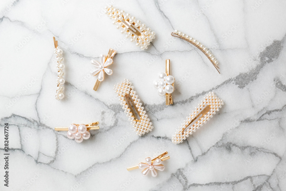 White Pearl Hair clips on marble, group of trendy hair accessories Stock  Photo | Adobe Stock
