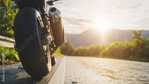 motorcycle in a sunny motorbike on the road riding.with sunset light. copyspace for your individual text. 