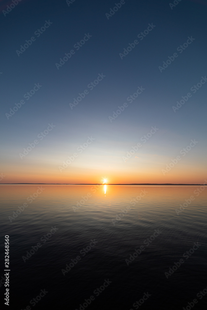 Calm serene sunrise lake scenery