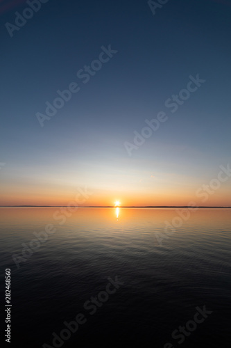 Calm serene sunrise lake scenery