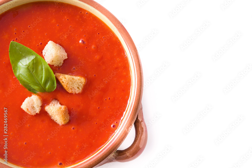 Tomato soup in brown bowl isolated on white background. Top view. Copyspace Tomato soup in brown bowl isolated on white background. Top view. Copyspace