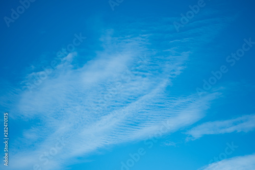 Deep blue sunny sky with white clouds
