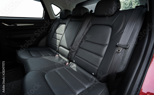 Closeup of a modern car interior with the black leather rear seats © jamesteohart