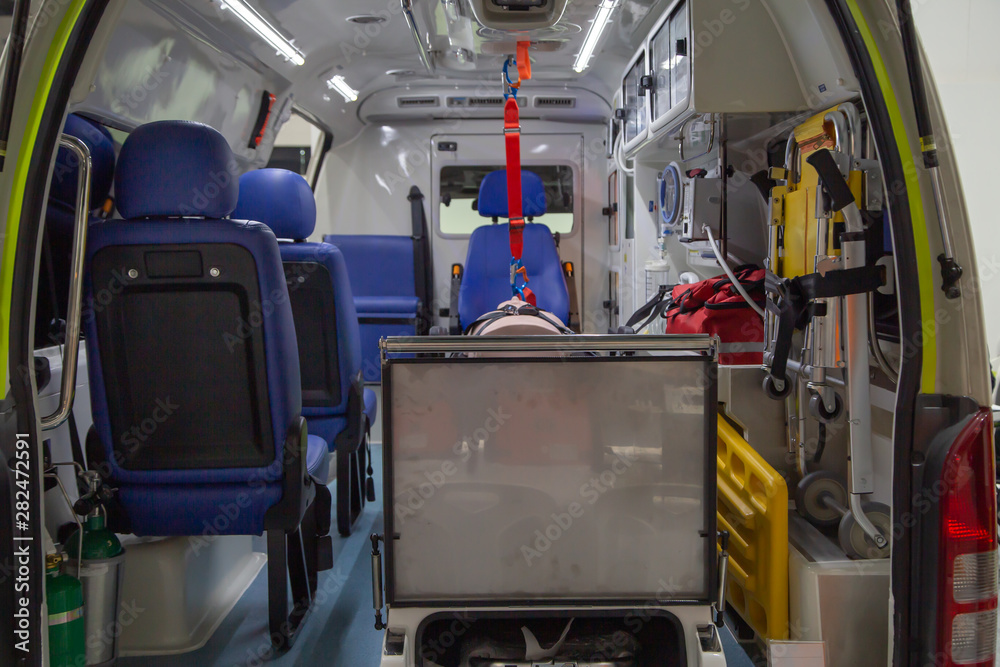Interior of an ambulance with bed, first aid and patient care equipment for emergency service