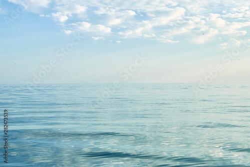 The calm water of the sea, ocean with blue sky. Summer seascape. Calmness, poise concept.