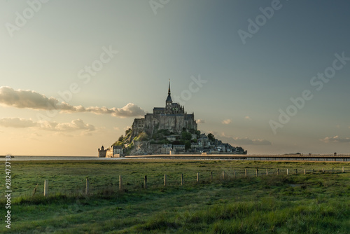 Mont Saint Michel view with fields and sunset