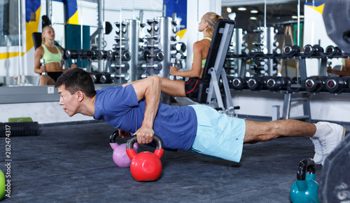 Man doing exercises with dumbbells