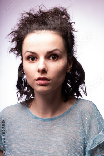 beautiful young curly girl close-up portrait