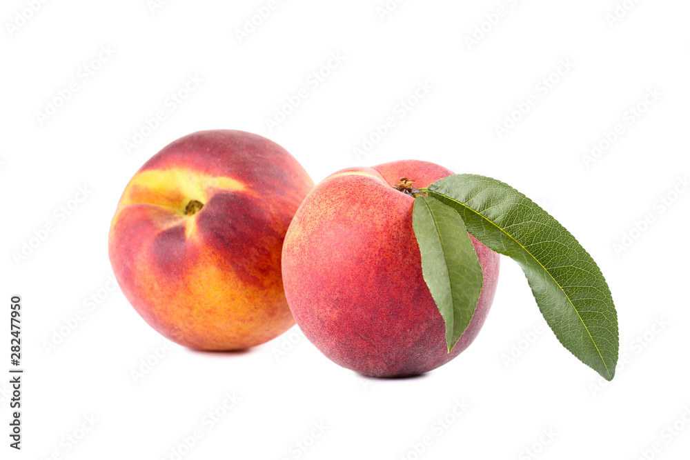 Fresh peaches with green leaf isolated on white background Fresh peaches with green leaf isolated on white background