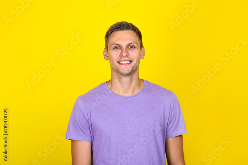 Portrait of young man on yellow background © 5second