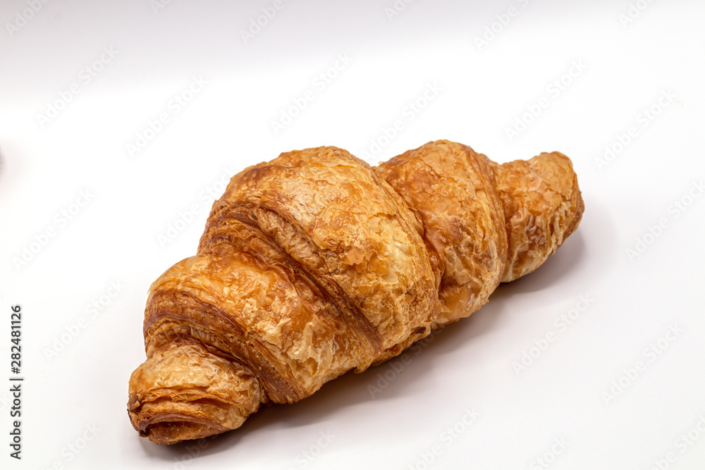 Fresh and tasty buttery croissants isolate on white background.