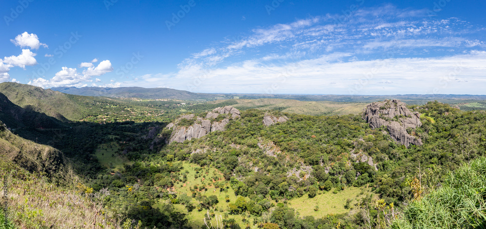 Beautiful aerial view of Serra do Cipo in Minas Gerais with forests and rock mountains in sunny summer day with blue sky. Landscape of the Brazilian Cerrado, one of the most devastated biomes.
