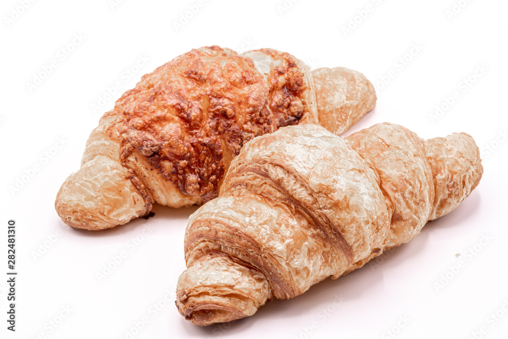 Fresh and tasty buttery croissants isolate on white background.