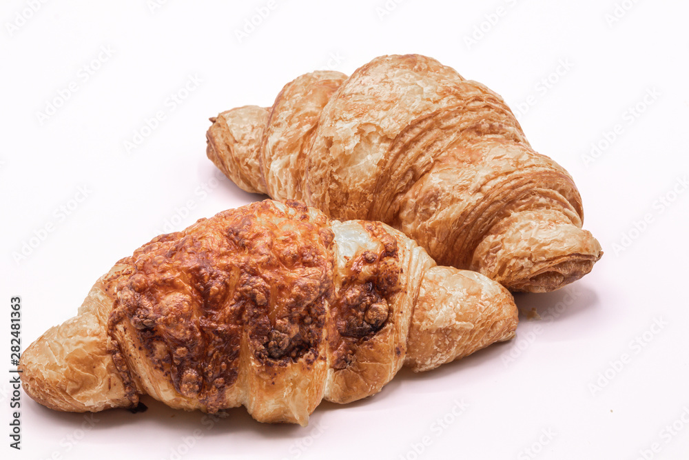Fresh and tasty buttery croissants isolate on white background.