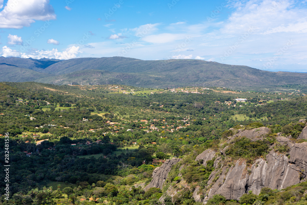 Beautiful aerial view of Serra do Cipo in Minas Gerais with forests and rock mountains in sunny summer day with blue sky. Landscape of the Brazilian Cerrado, one of the most devastated biomes.