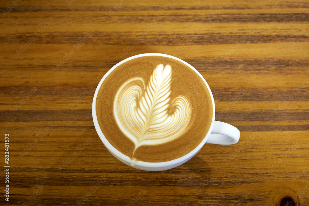 High Angle View Of Coffee On Wooden Table High Angle View Of Coffee On Wooden Table