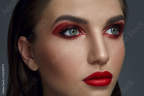Close-up portrait of a beautiful fashion model with professional make-up.