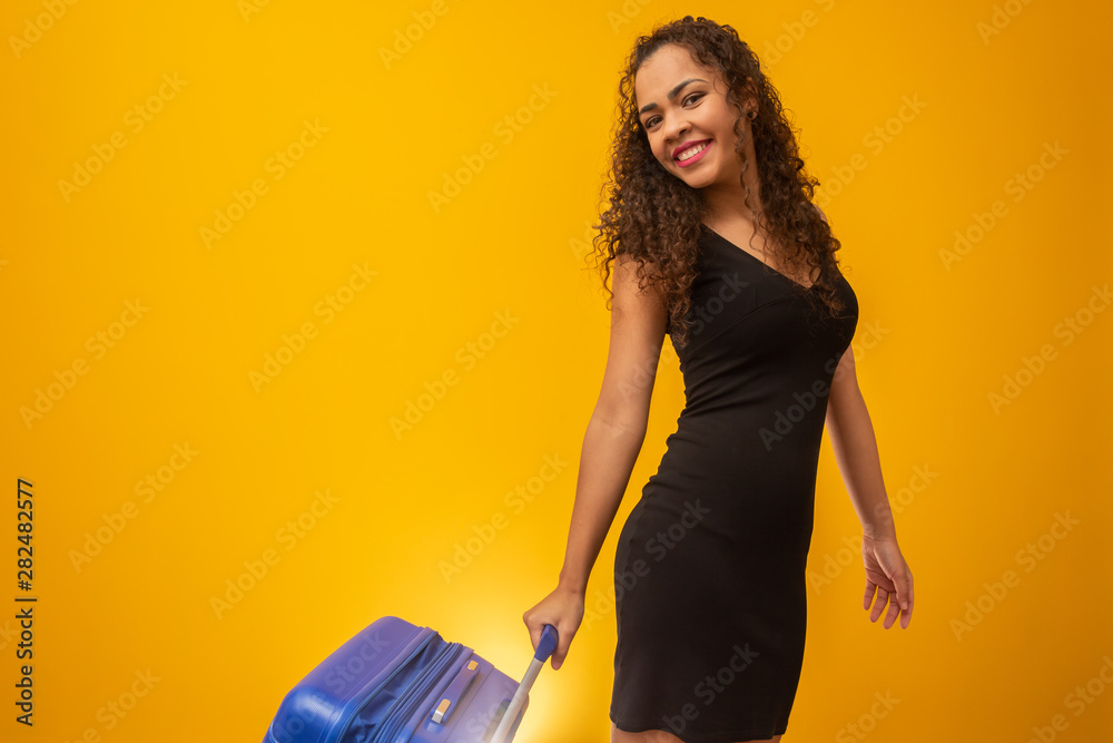 Beautiful curly-haired girl in travel bag. Next trip Beautiful curly-haired girl in travel bag. Next trip