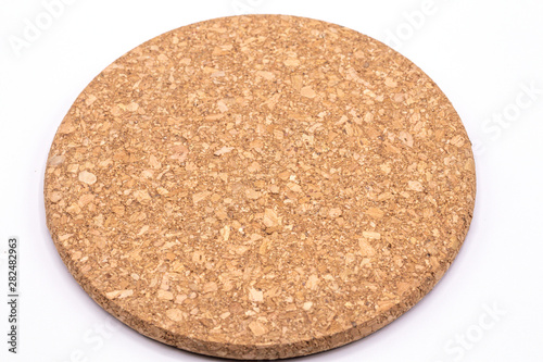 Close up kitchen cork plate mat on white background.