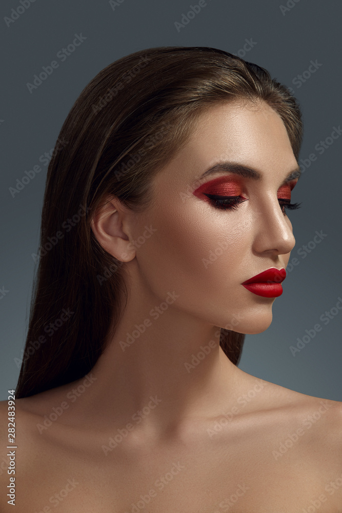 Close-up portrait of a beautiful fashion model with professional make-up. Close-up portrait of a beautiful fashion model with professional make-up.