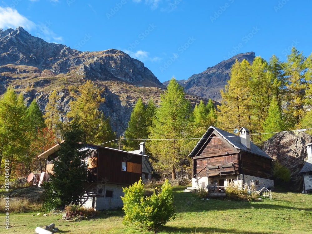 A mountain pasture with its typical houses immersed in the Nature of the Natural Park 