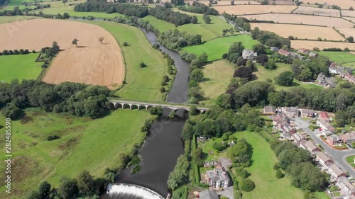 Aerial photo of the the historic Tadcaster Viaduct and River Wharfe located in the West Yorkshire British town of Tadcaster, taken on a bright sunny day photo