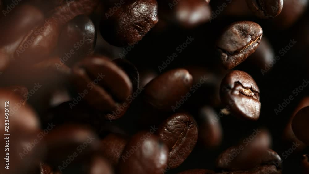 Super slow motion of flying coffee beans. Filmed on high speed cinema camera, 1000 fps. Super slow motion of flying coffee beans. Filmed on high speed cinema camera, 1000 fps.
