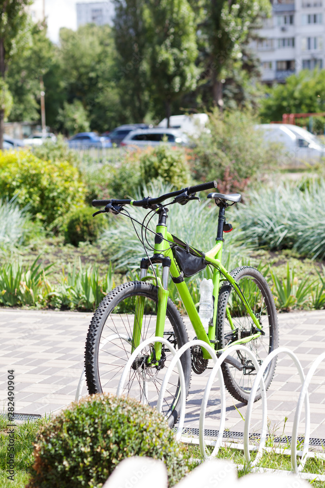 Parking for bicycles in the park. The concept of a healthy lifestyle