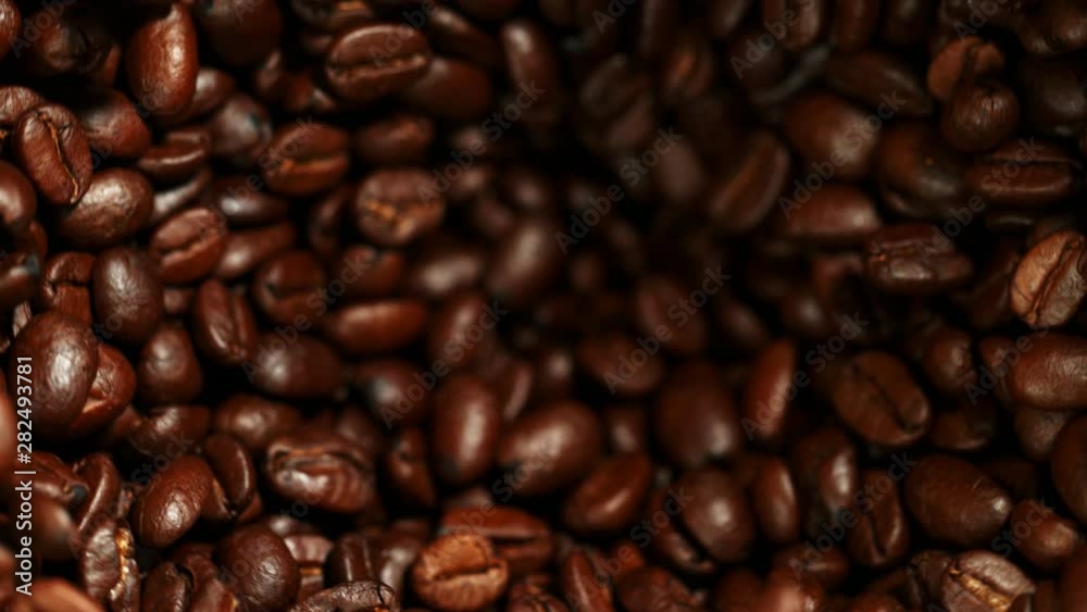 Super slow motion of grinding coffee beans. Filmed on high speed cinema camera, 1000 fps. Super slow motion of grinding coffee beans. Filmed on high speed cinema camera, 1000 fps.