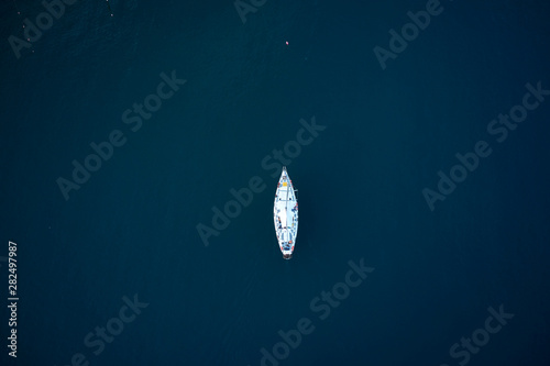 top view of a beautiful sailboat in the sea photo