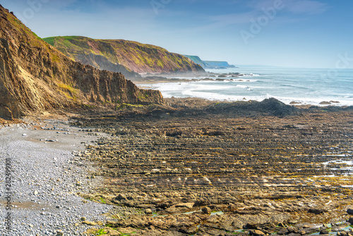 Obraz na płótnie View of Childspit beach near Hartland Quay in North Devon Coast AONB. Copy space in sky. w salonie