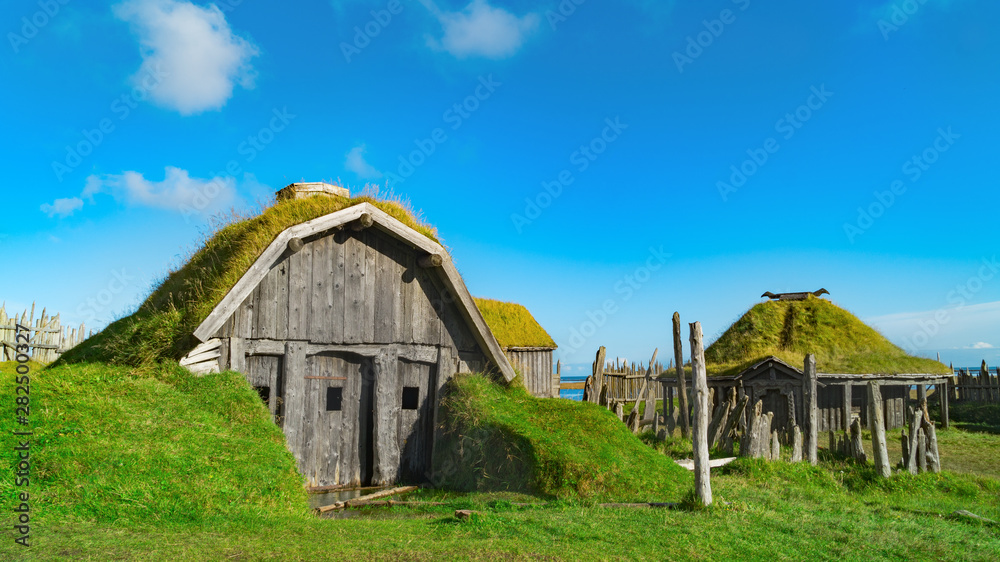 Obraz premium Traditional antique Viking village. Old wooden houses near Vestrahorn mountains on the Stokksnes Peninsula, Hofn, Iceland. Popular tourist attraction.