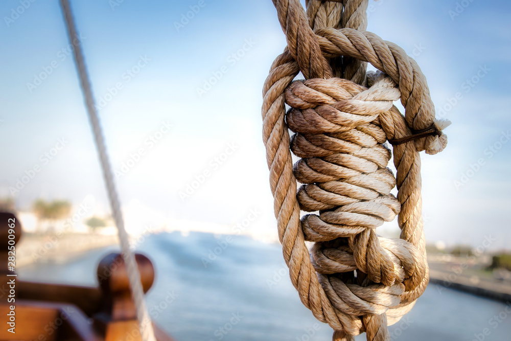 Ancient ship rope forming a sailor knot. Stock Photo