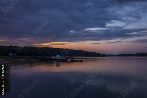 A traditional lifeguard and changing dress shelter on a wooden pier near the town of Porvoo in Finland at sunset in summer - 8