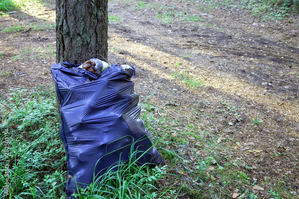 Large Garbage Bag Filled To With Plastic Waste Leaning Against