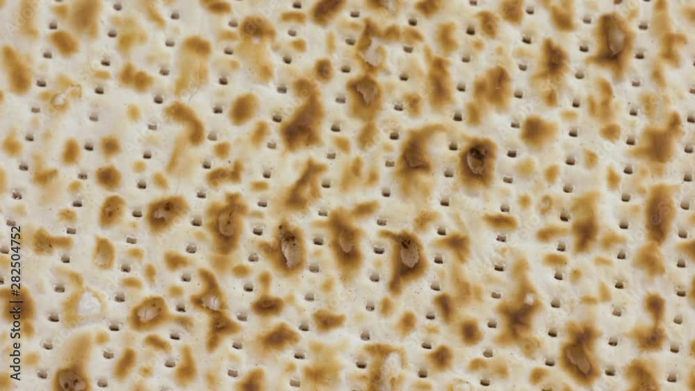 Closeup of rotating Passover Matzoh, Jewish Holiday Bread Closeup of rotating Passover Matzoh, Jewish Holiday Bread