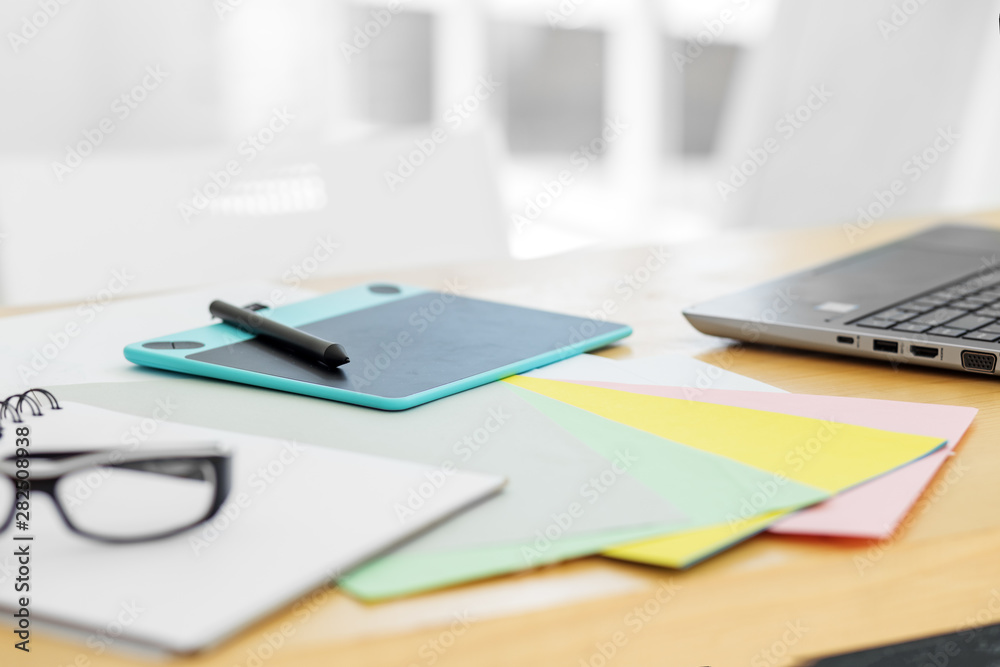 Graphics tablet on the desktop. Free space for text. Office workplace. Graphics tablet on the desktop. Free space for text. Office workplace.