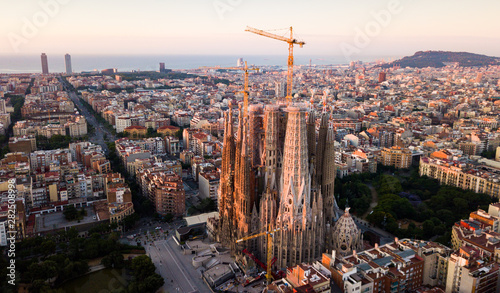 Barcelona, Spain - June 13, 2019: Aerial panorama view of Barcelona city skyline and Sagrada familia at dusk time