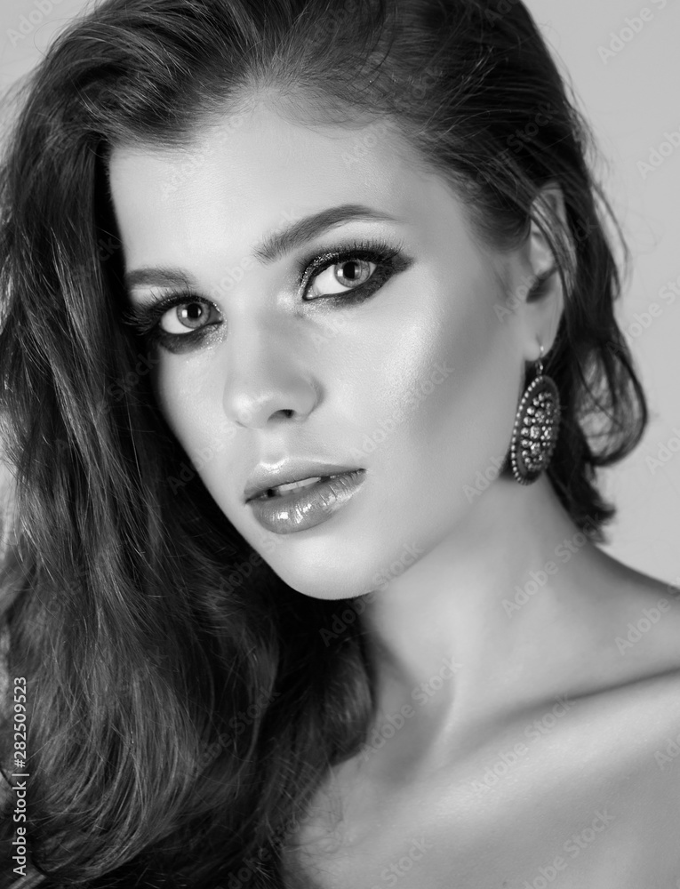 Close up monochrome portrait of a cute girl with nice makeup.