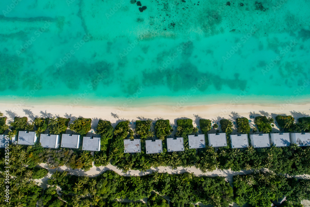 Obraz premium Aerial view of beautiful island at Maldives in the Indian Ocean. Top view from drone.
