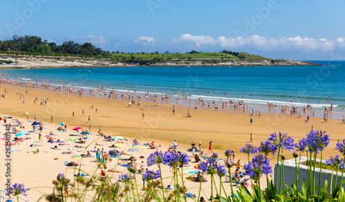 Santander, Spain - July 14, 2019: Beach in Santander, Spain. Resort town known for its sandy beach photo