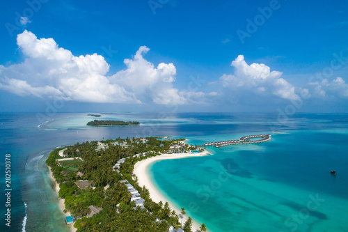 Fototapeta Naklejka Na Ścianę i Meble -  Aerial view of beautiful island at Maldives in the Indian Ocean. Top view from drone.