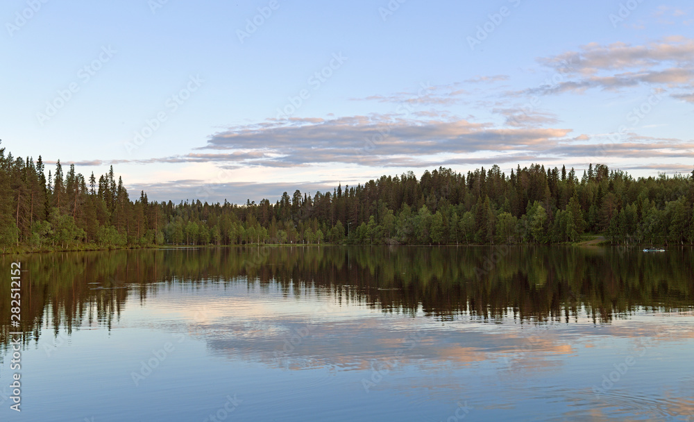 Beautiful sunset on Talvijarvi Lake in Ruka, Lapland, Finland. Summer night