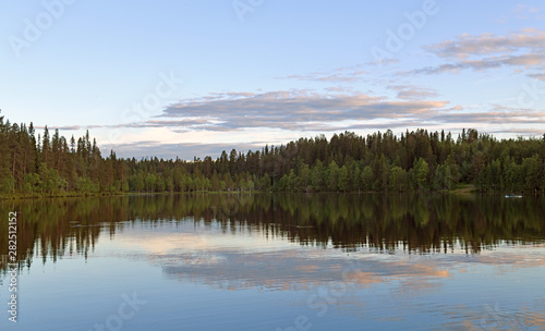 Beautiful sunset on Talvijarvi Lake in Ruka, Lapland, Finland. Summer night