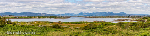 Panorama with Farm field, Bay and mountains in Carraroe