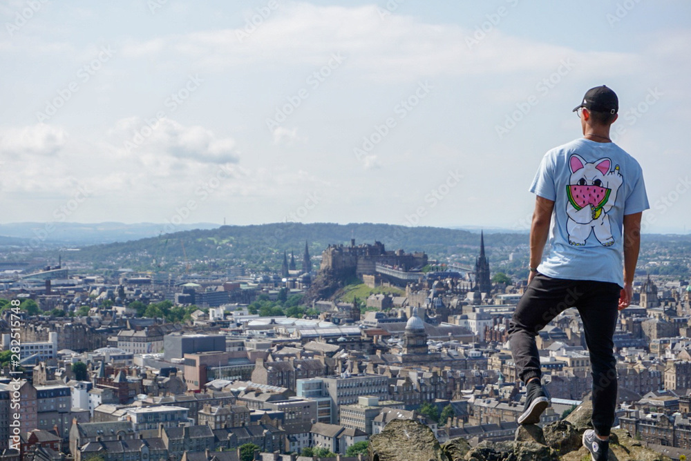 Guy admiring the Edinburg Skyline.