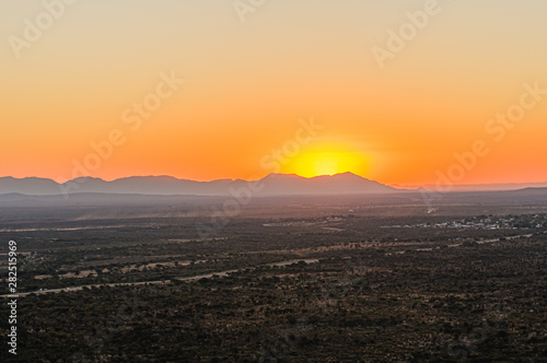African sunset behind mountains from Otjiwarongo, Namibia © Stephen