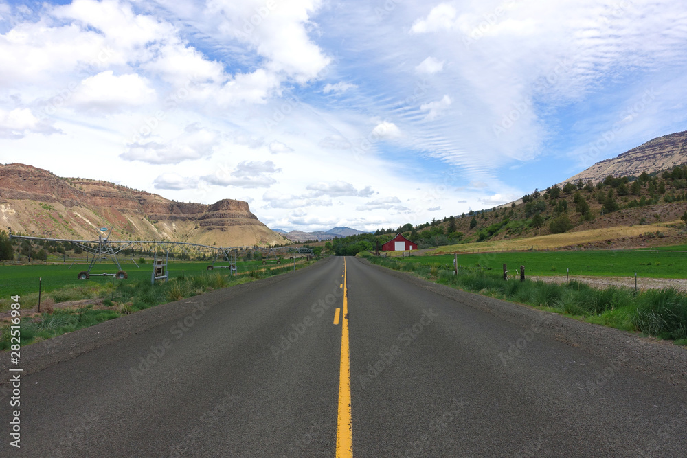 Driving on a rural road in the John Day Fossil Beds National Monument, Oregon